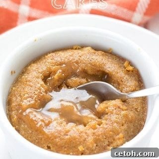 Sugar-free caramel oozing out of a keto pumpkin caramel lava cake, with an orange napkin in the background.