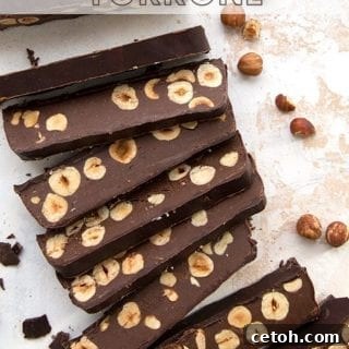 Titled image of keto chocolate torrone. Top down photo of slices of torrone cut to expose the hazelnuts