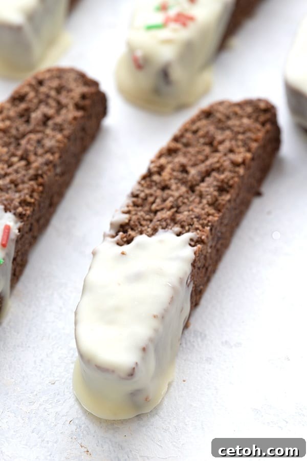 Close up shot of keto gingerbread biscotti dipped in sugar-free white chocolate