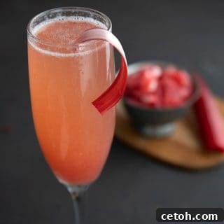Zero-Sugar Rhubarb Fizz 2 Close up shot of the top of a champagne flute filled with rhubarb fizz cocktail.