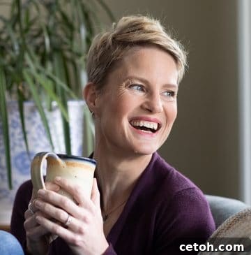 Photo of Carolyn Ketchum drinking coffee and laughing.