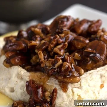 Keto baked brie with a pecan praline topping.