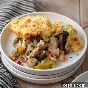 A white plate filled with a serving of Keto Chicken Pot Pie.