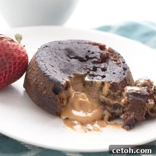 Molten Keto Peanut Butter Chocolate Bliss 2 Titled image of keto chocolate peanut butter lava cake broken open to show the gooey inside.