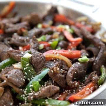 Close up shot of Chinese Pepper Steak in the pan.