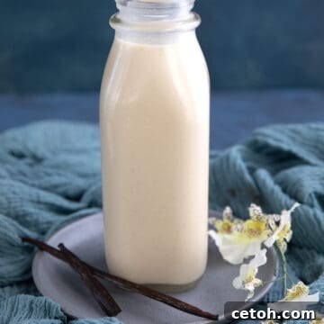 A glass bottle filled with homemade low carb coffee creamer.