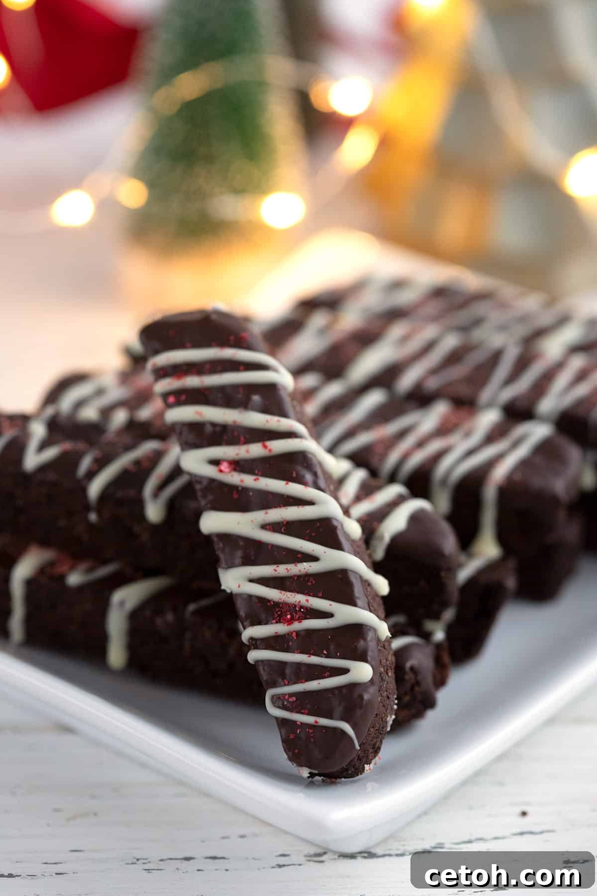 Close up shot of keto chocolate peppermint biscotti on a white plate.