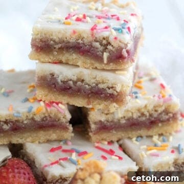 A stack of keto pop tart bars close up on a white wooden table.