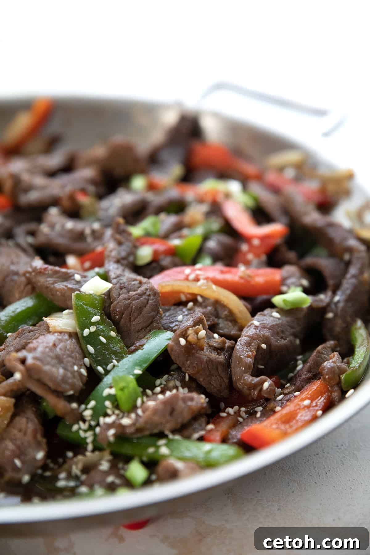Close up shot of Chinese Pepper Steak in the pan.