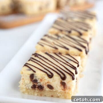 Keto Cannoli Cheesecake Bars lined up on a small white tray.