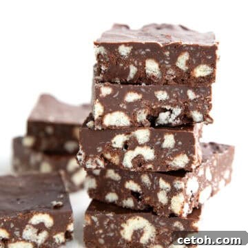 Easy Keto Crunch Bars in a stack on a white background.