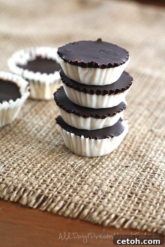 A stack of Low Carb Chocolate Coconut Cups on a piece of burlap, titled: Low Carb Chocolate Coconut Cups - Better than a Mounds Bar!