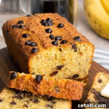 A loaf of keto banana bread with a few slices next to it