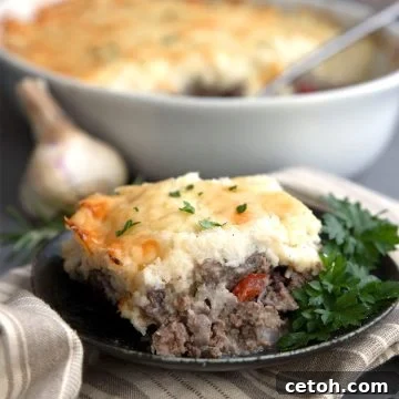 A slice of Keto Shepherd's Pie on a black plate.