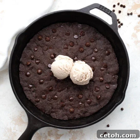 Keto Chocolate Skillet Cookie top down with two scoops of ice cream on top.