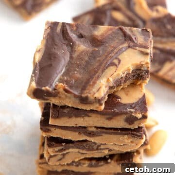 A stack of keto tiger butter squares on a marble table.