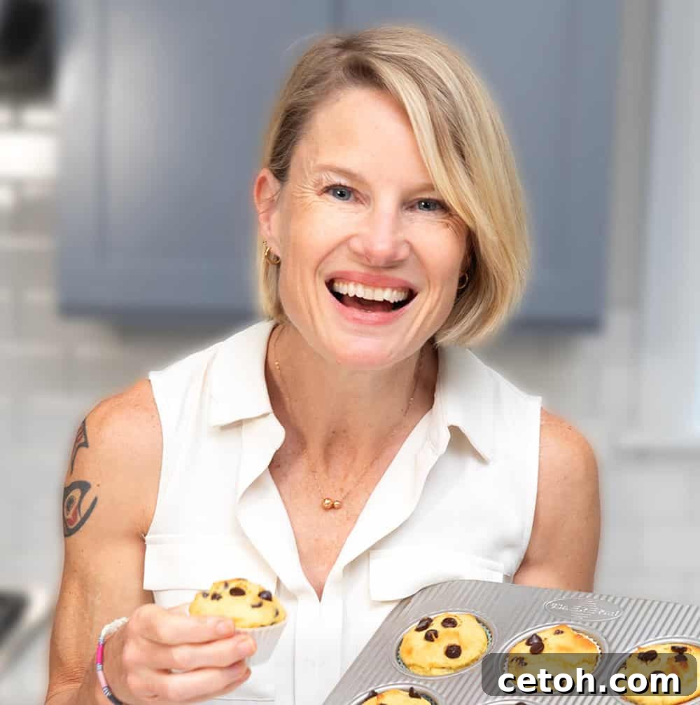 Tiramisu Protein Mousse Recipe 2 A photo of Carolyn Ketchum in a white shirt holding muffins.